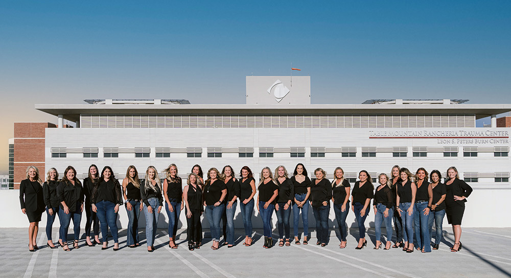 founders club women dressed in black shirts and blue jeans