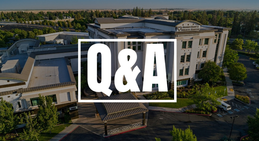 An exterior drone shot of Fresno Heart & Surgical Hospital with "Q&A" in white letters over it.