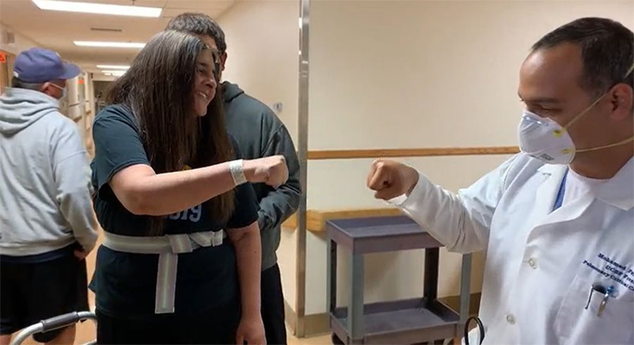 Michelle Delgado fist bumps Dr. Fayed