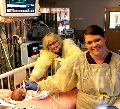 Joy Guthrie and Robyn Nachtigall-Hill in the NICU